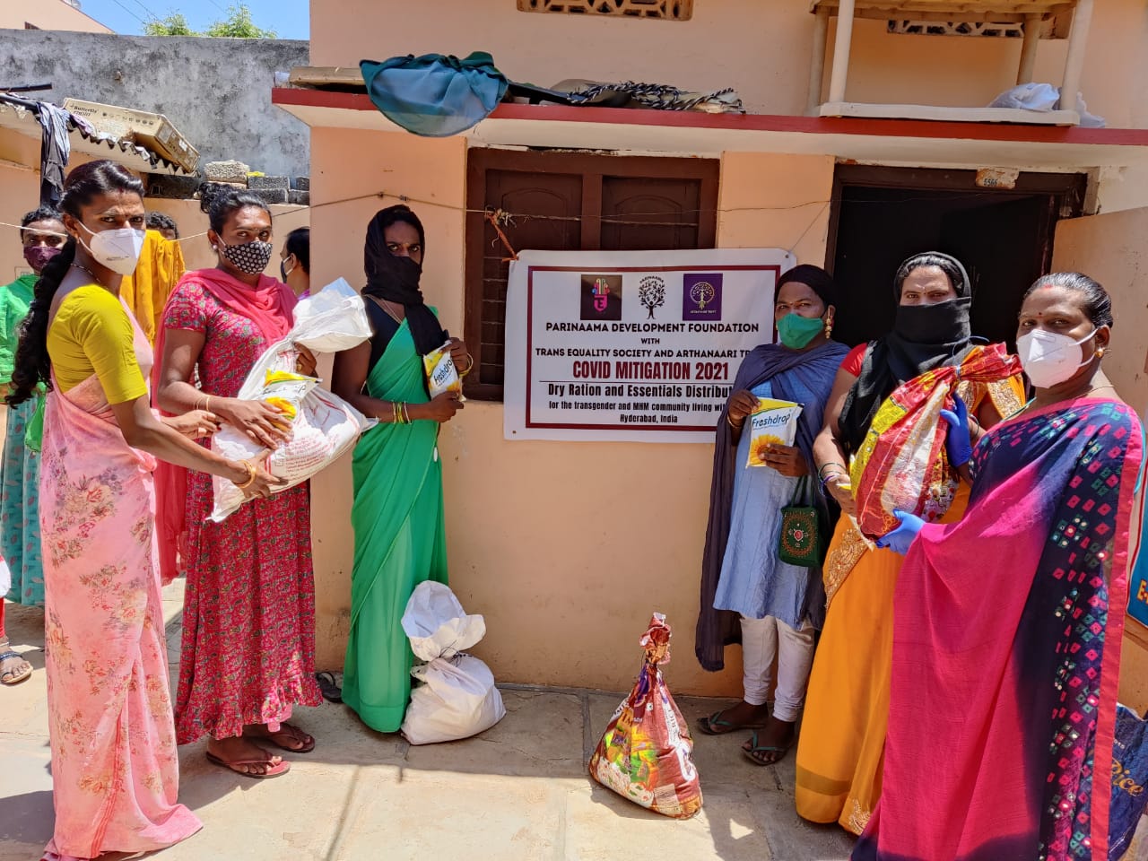 A group of women is standing outside a training facility.