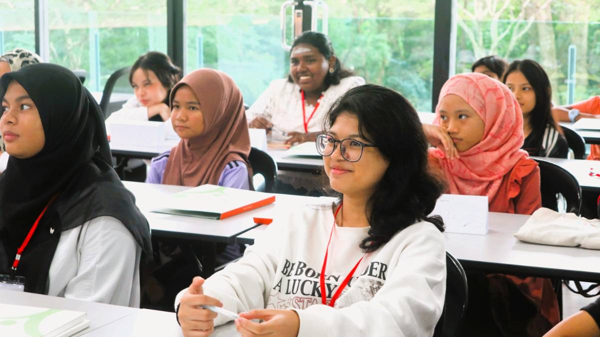 Girls listen attentively in a class.