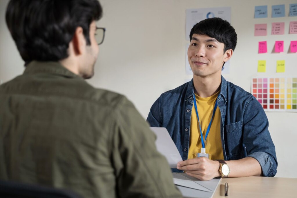 A recruiter interviews a job applicant, highlighting inclusive recruitment in a neurodiversity hiring program.